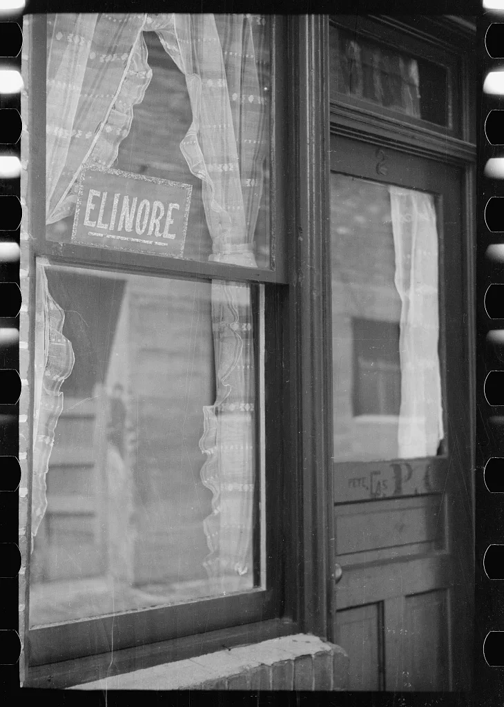 Sign in window, Venus Alley, Butte, Montana, 1939