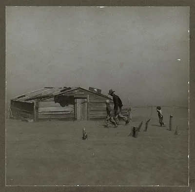 Photograph from Oklahoma: Farmer and sons walking in the face of a dust…