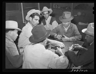 Domino game on Saturday night. Community center. Robstown camp, Texas, 1942