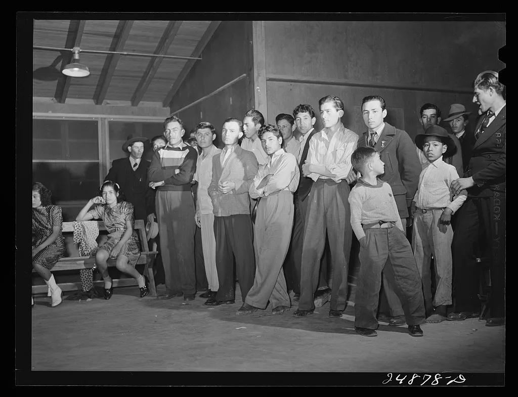 Stag line at Saturday night dance. Robstown camp, Texas, 1942
