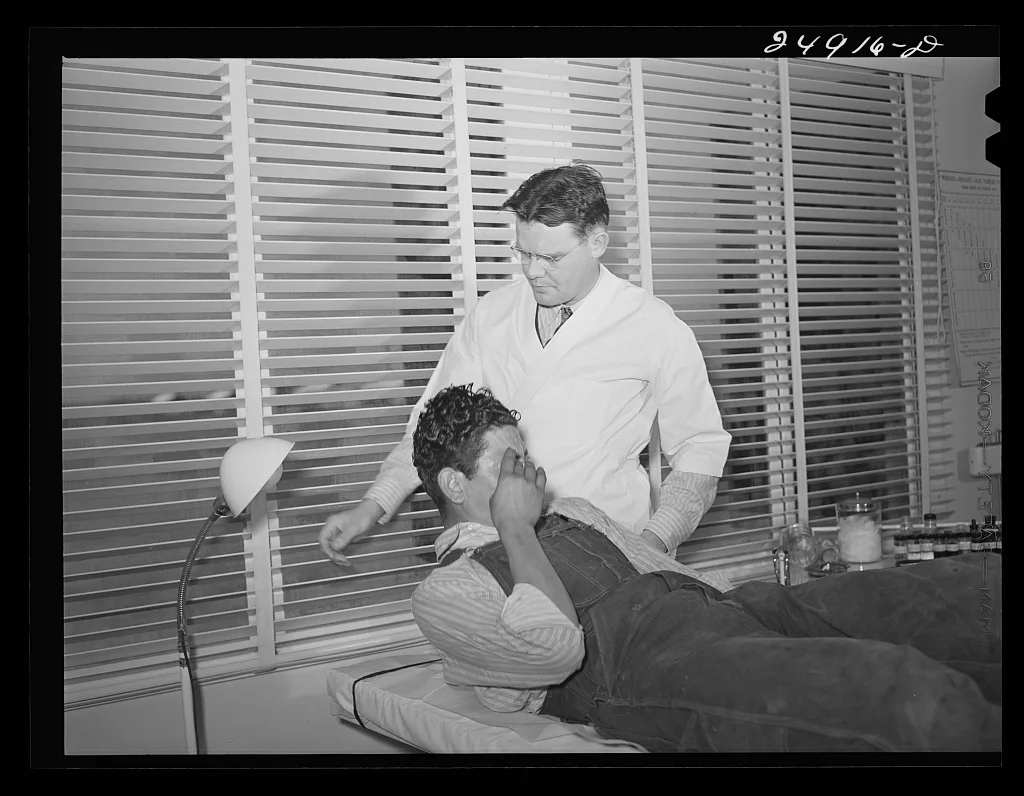 [Untitled photo, possibly related to: Doctor examining patient.…, Texas, 1942