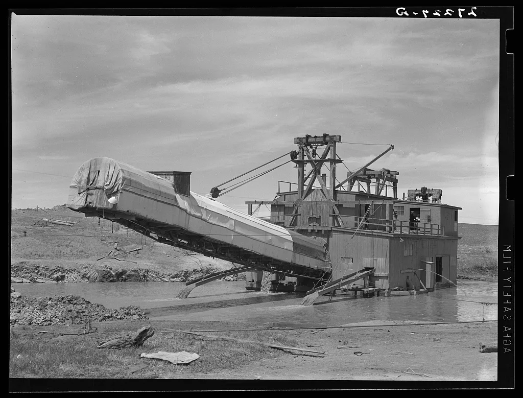 Dredge used in placer gold mining. Madison County, Montana, 1939