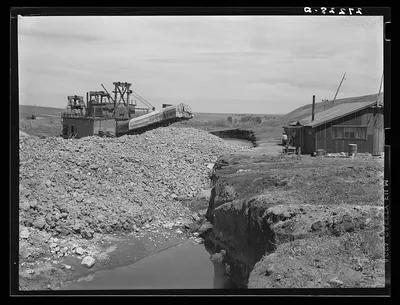 Tailing piles left by gold dredge. Madison County, Montana, 1939