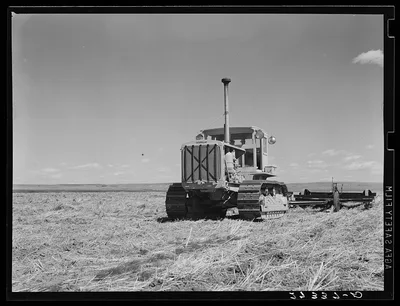 Tractor with noble blade on Sheffels' wheat farm. Cascade County,…, Montana, 1939