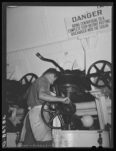 [Untitled photo, possibly related to: Operating a centrifugal…, Colorado, 1939