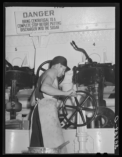 Operating a centrifugal machine. Sugar beet factory. Brighton,…, Colorado, 1939