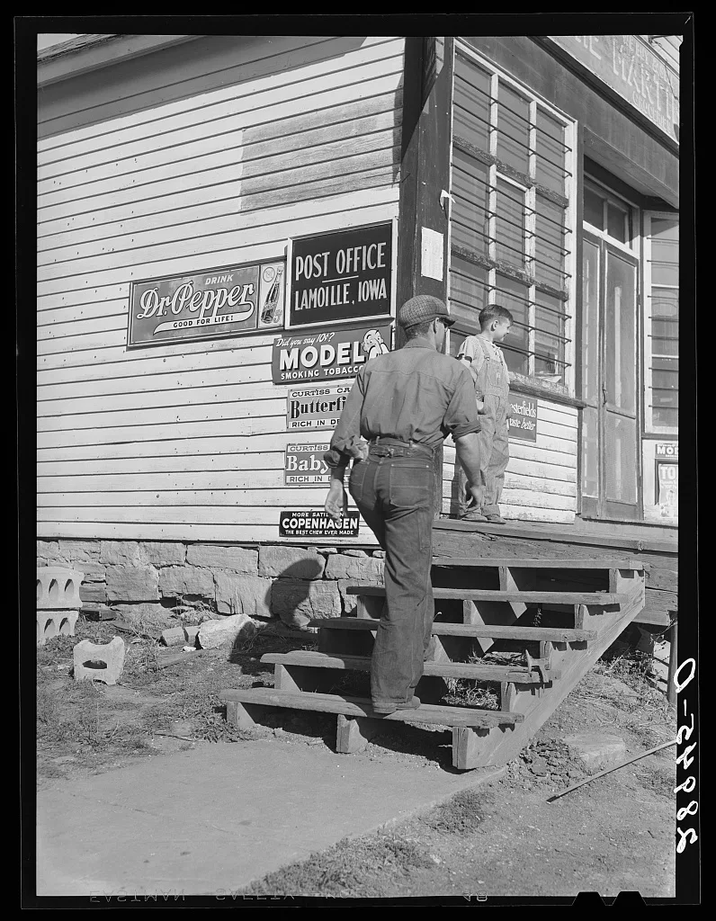 [Untitled photo, possibly related to: Carrying bags of flour out of…, Iowa, 1939