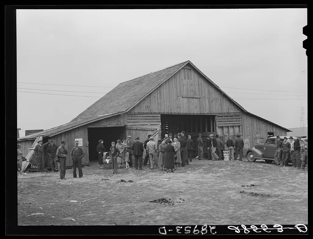 Farmers and their families gather around barn before cornhusking…, Iowa, 1939