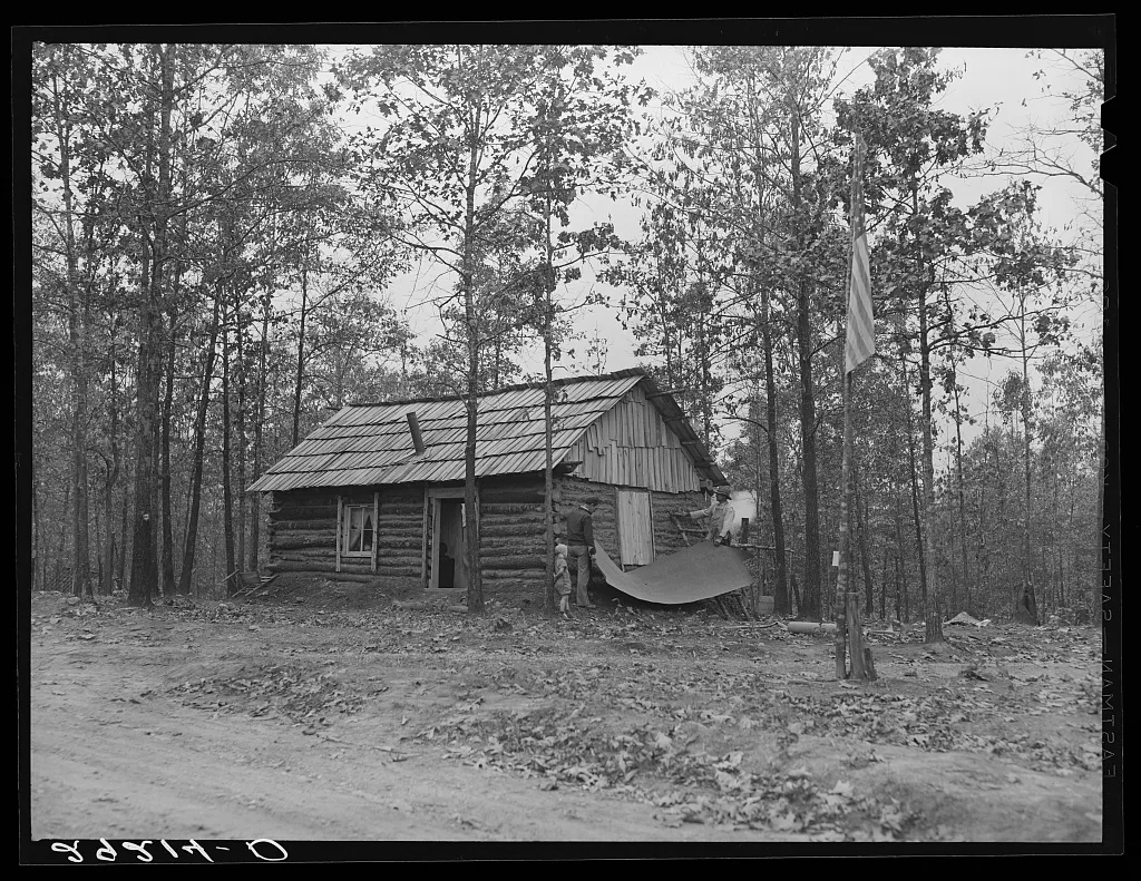 Evicted sharecroppers building a cabin. Butler County, Missouri, 1939