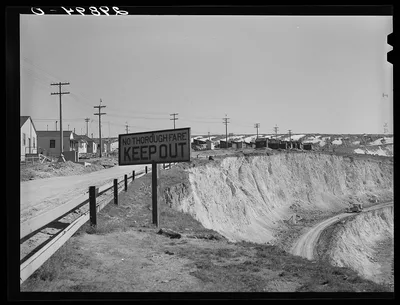 Workers' homes on edge of copper pit. Ruth, Nevada, 1940