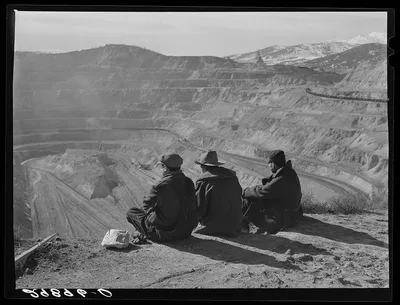 Workers sitting at edge of copper pit. Ruth, Nevada, 1940