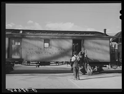 Loading mail into railroad car. Carson City, Nevada, 1940